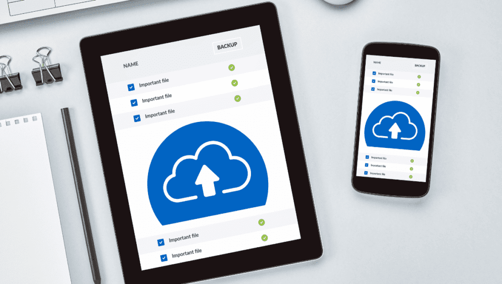 5 Small Business Cloud Storage Providers to Consider in 2023 2 small business cloud storage providers - A tablet and phone, both featuring a cloud icon, are displayed together.