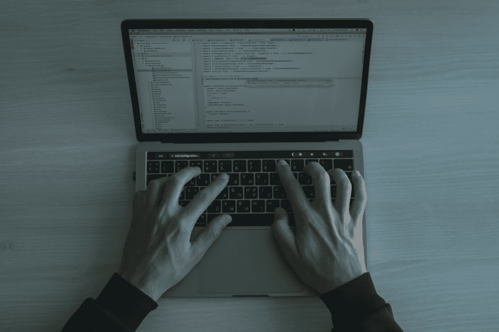 Understanding WordPress XML-RPC Attacks and How to Stop Them 3 A person's hands typing on a laptop computer while defending against WordPress XML-RPC Attacks.